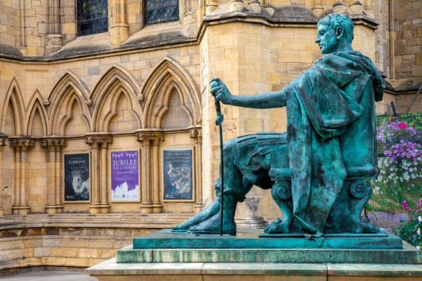 Statue of Constantine the Great at York Minster in York, UK York, UK - June 6th 2022: The statue of Roman Emperor Constantine the Great, with the exterior of York Minster pictured behind, in the beautiful city of York, UK. statue of emperor constantine york minster stock pictures, royalty-free photos & images