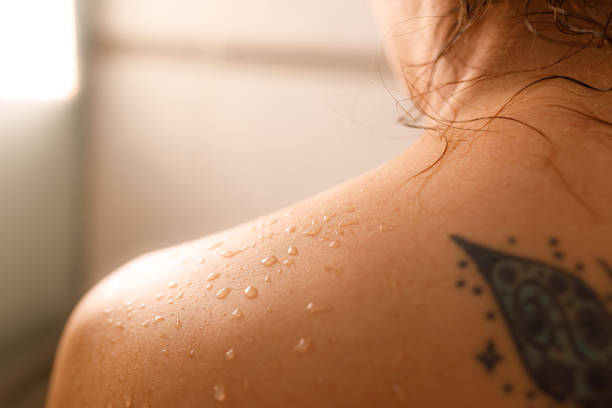 istock Water drops over person's shoulder at the shower 1407157303