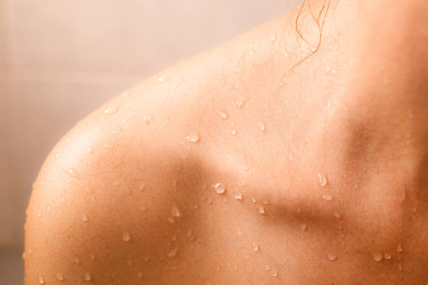 istock Water drops over person's clavicle 1407157307