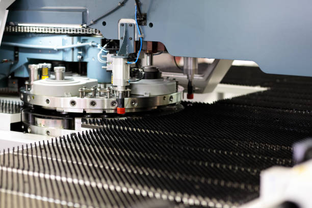 istock industrial CNC turret punching machine close up 1407158878