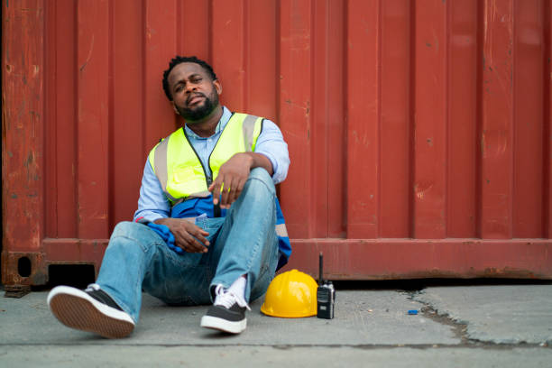 istock African American cargo container worker or technician sit and lean on container tank and action look like tired after work in workplace area for long time. 1407160174