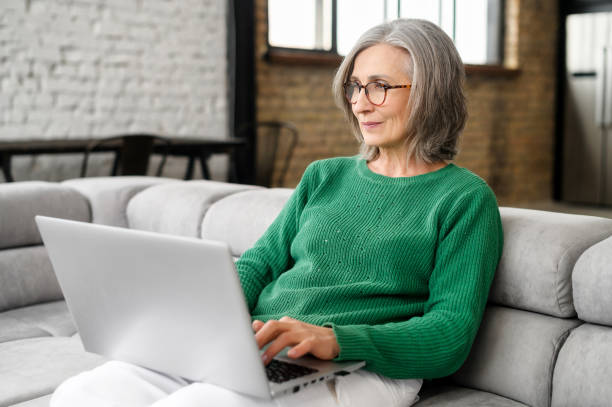istock Mature lady female freelancer typing email 1407163002
