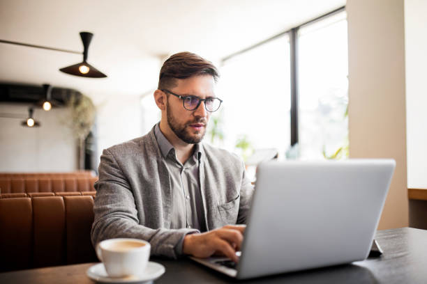 istock Businessman using laptop on a coffee break 1407163292