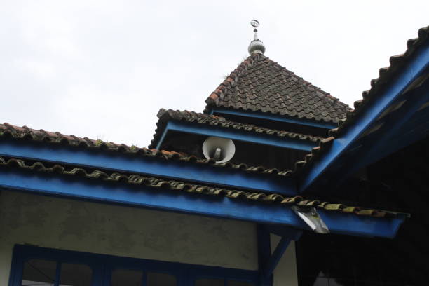 Old white speaker in the corner of an old mosque