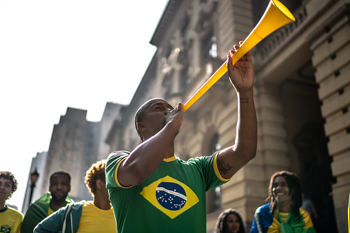 Young man celebrating a soccer match outdoors