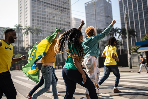 Brazilian fans walking and celebration outdoors