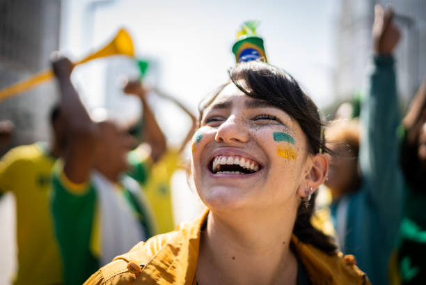 istock Young woman cheering for the nacional team 1407167603