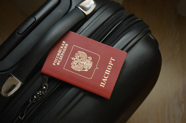 istock Russian passport on a suitcase for travel. an identity document. Russian Federation 1407169097