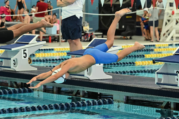 istock Young Boy Swimming at a Swim Meet 1407169112