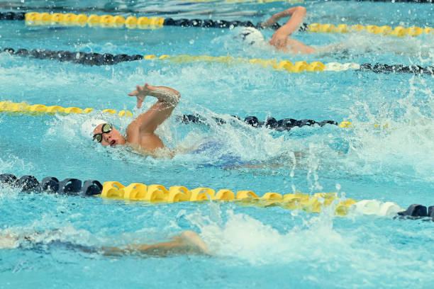 istock Young Boy Swimming at a Swim Meet 1407169116