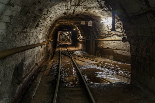 istock Dark tunnel in iron ore mine. 1407170193