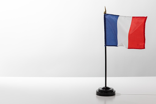 Flying Country Flag France isolated on white table with grey background