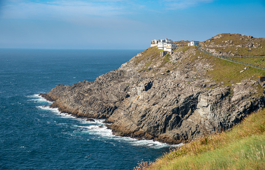 Mizen Head Signal Station with dramatic rocky coastline in the Atlantic ocean . County Cork, Ireland.