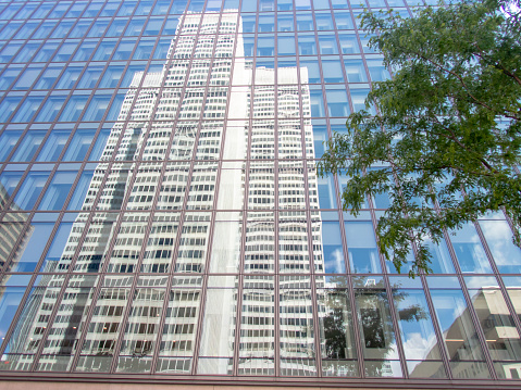 Reflected view of Place Ville-Marie on the next building's windows. Montreal downtown area.