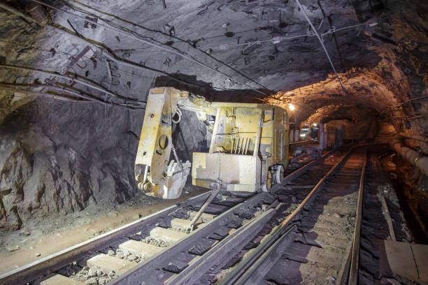 istock Railway excavator in tunnel of iron ore mine. 1407170461