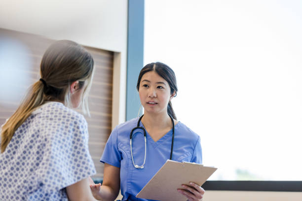 Female patient talks to her nurse