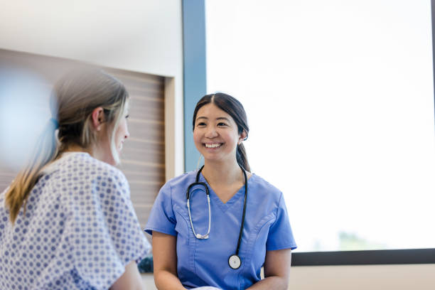 istock Nurse smiles proudly to her patient 1407170553