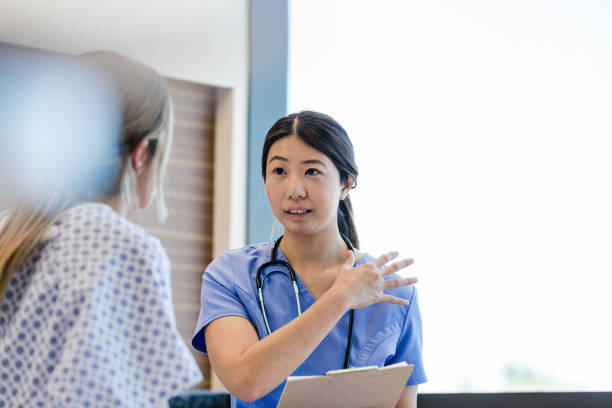istock Nurse gestures to clarify information she is receiving from the patient 1407170554