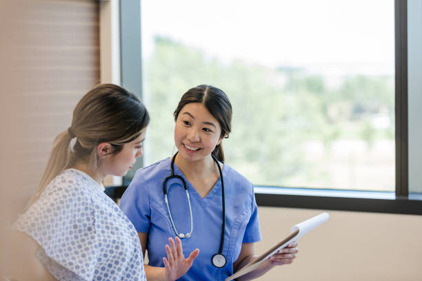 istock Doctor gestures to the patient while they talk 1407170570