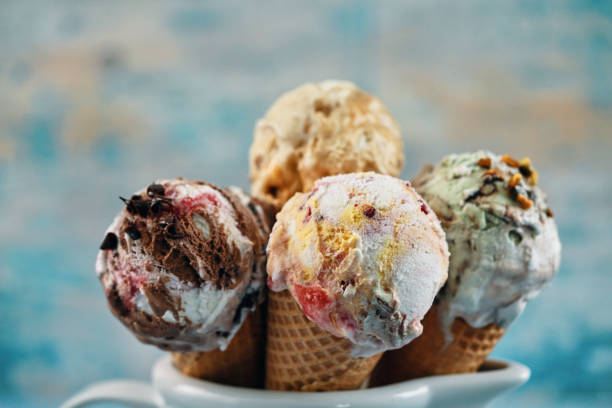 istock Pistachio, Chocolate, Strawberry and Vanilla Ice Cream in a Cone 1407172091