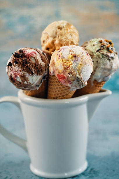 istock Pistachio, Chocolate, Strawberry and Vanilla Ice Cream in a Cone 1407172094