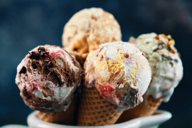 istock Pistachio, Chocolate, Strawberry and Vanilla Ice Cream in a Cone 1407172104