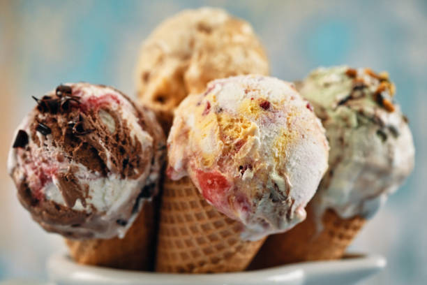 istock Pistachio, Chocolate, Strawberry and Vanilla Ice Cream in a Cone 1407172121