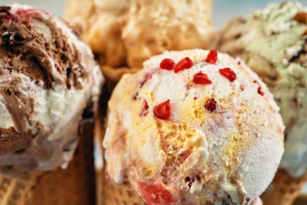 istock Pistachio, Chocolate, Strawberry and Vanilla Ice Cream in a Cone 1407172122