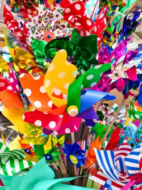 istock Many colourful windmills in rainbow colours - Toy concept. 1407172125