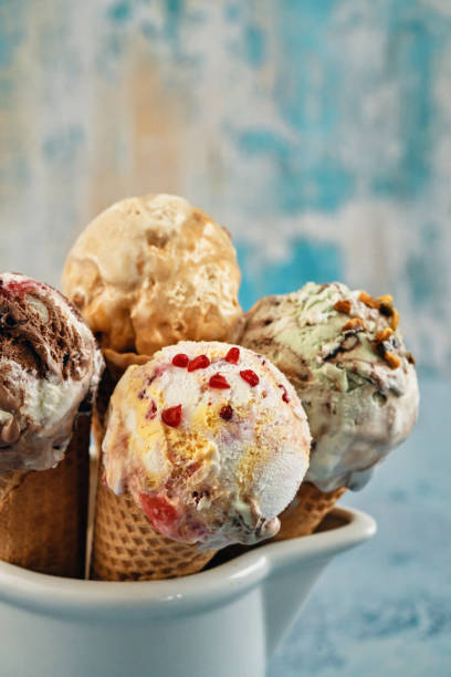 istock Pistachio, Chocolate, Strawberry and Vanilla Ice Cream in a Cone 1407172127