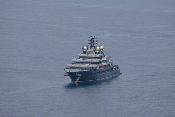 Luxury motor yacht on the ocean at sunset. A large private motor yacht under way out at sea. Corsica. France