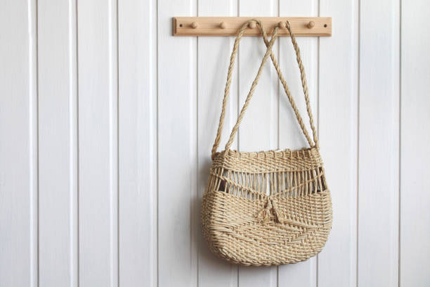 istock women's wicker bag hangs on a hanger. 1407176856