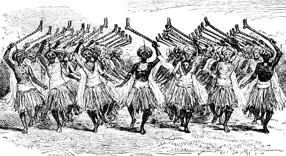 A group of warriors performing the traditional dance called Meke i wau or Meke mada in Fiji. Vintage etching circa 19th century.