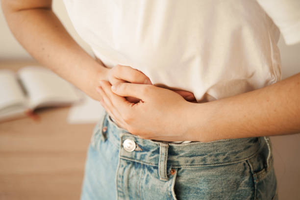 Stomach pain. Gastritis is an inflammation, irritation, or erosion of lining of stomach. Sick girl hold abdomen because it hurts. Stomach pain. Gastritis is an inflammation, irritation, or erosion of lining of stomach. Sick girl hold abdomen because it hurts endometriosis bloated stock pictures, royalty-free photos & images