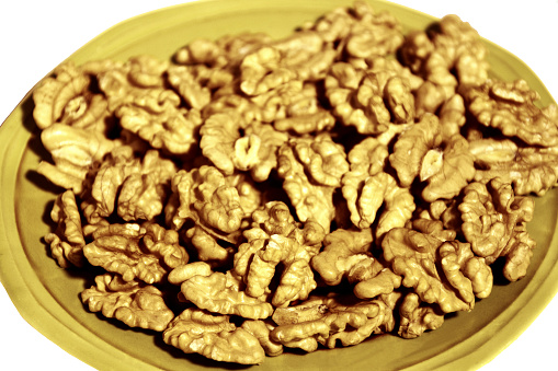 Eatable Dry Fruit Walnuts without shells kept in a Plate.