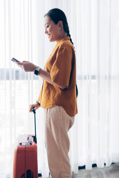istock Asian Woman On Her Phone 1407182799