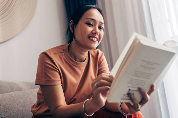 istock Asian Woman Reading A Book 1407182852
