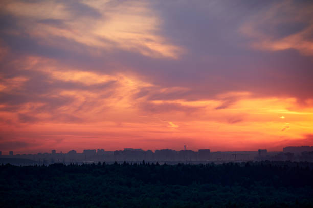 istock Evening sky with setting sun through clouds at sunset, cloudy landscape 1407183763