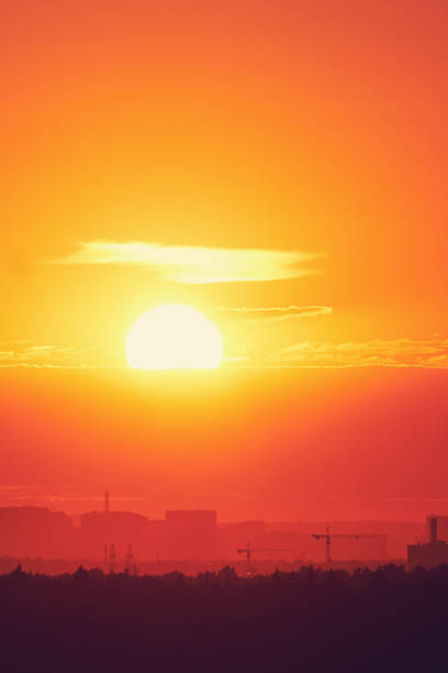 istock Evening sky with setting sun through clouds at sunset, cloudy landscape 1407184299