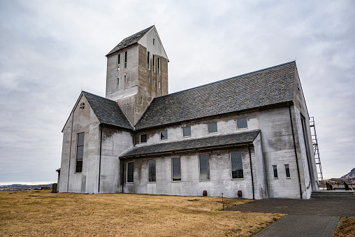 The famous Skálholt Cathedral or Skálholtsdómkirkja, Iceland, during a renovation, without the usual white paint, showing only the bare concrete of the church building