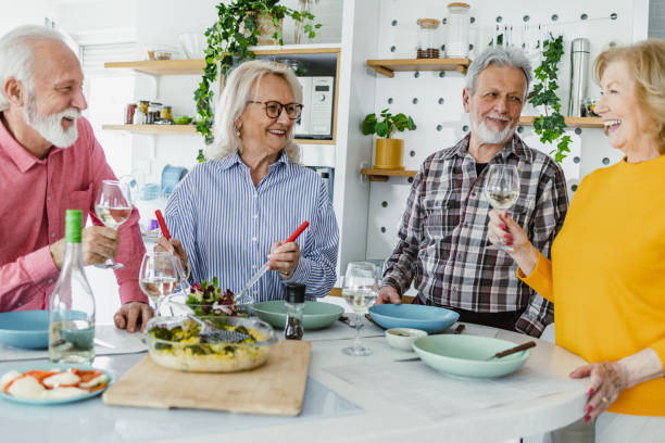istock Cheerful seniors having lunch at home 1407185817