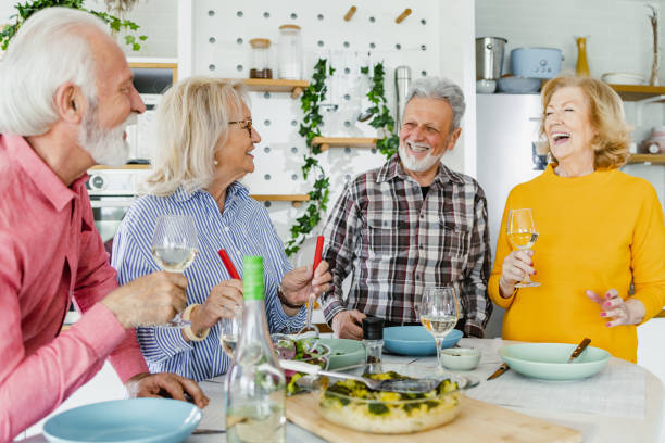 istock Cheerful seniors having lunch at home 1407185826