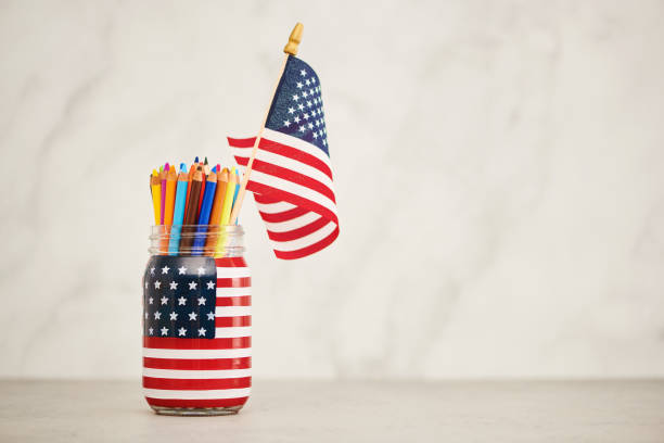 istock Jar painted with American flag filled with colored pencils. Space for copy 1407188463
