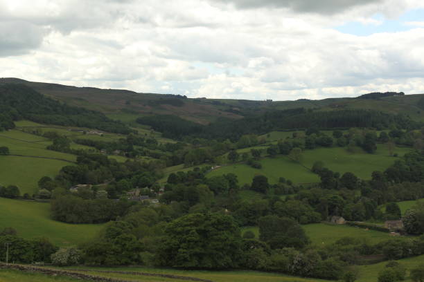 istock All green on Hills and with clouds 1407189425