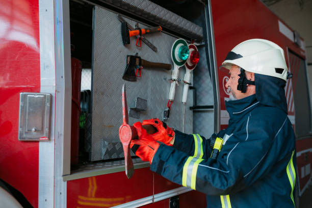 istock Firefighter organizing his equipment in the fire station 1407189668