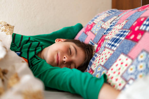 istock The seven-year-old boy wakes up. 1407190291