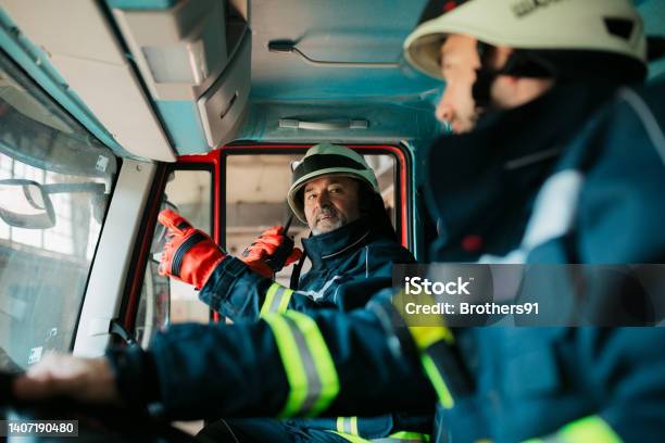 Firefighters Getting Ready To Leap Into Action Stock Photo - Download Image Now - Firefighter, Radio, Walkie-talkie