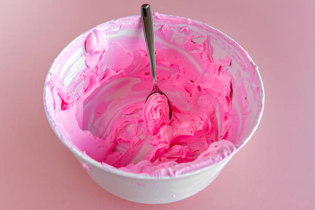istock bowl with pink whipped cream scraping. 1407191845