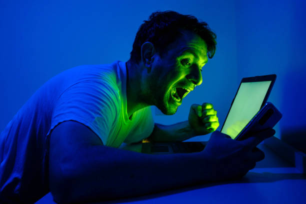 istock Happy young man in front of his laptop 1407192281