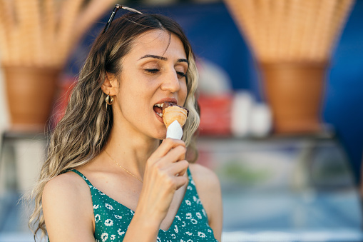Young woman eating ice-cream